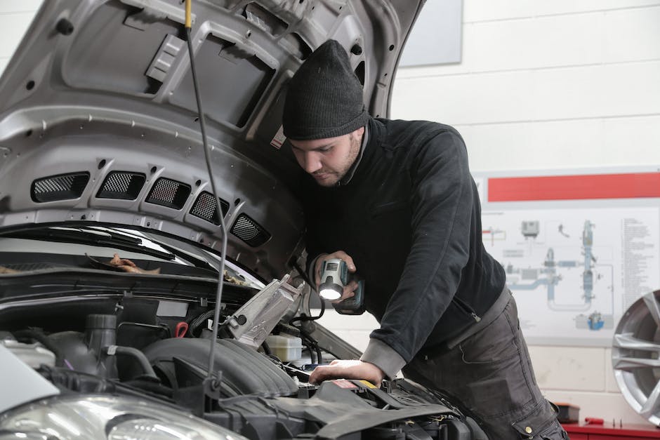 A mechanic inspecting a car engine